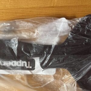Black and white Tupperware gloves in plastic packaging.