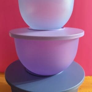 Stacked pastel bowls on a vibrant background.