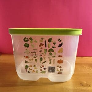 Plastic container with various plant illustrations on the side.